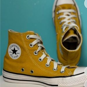 High top converse in golden dart